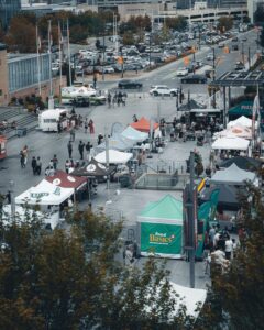 A bustling outdoor cultural festival in Mississauga with food stalls and people enjoying the day.